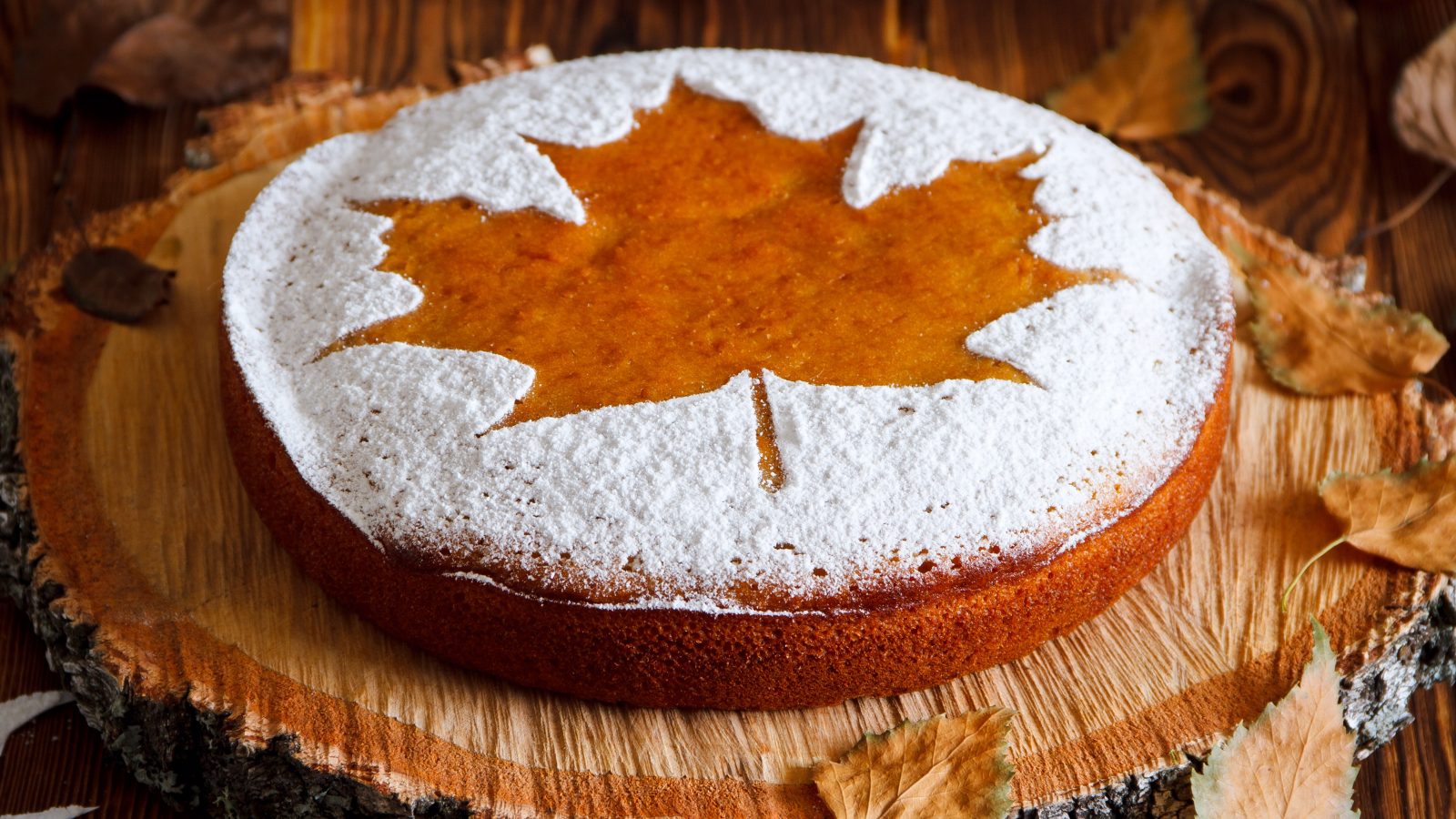 Homemade tasty manna pie with a sugar powder (stencil of a mapl