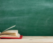 Education and reading concept - group of colorful books on the wooden table