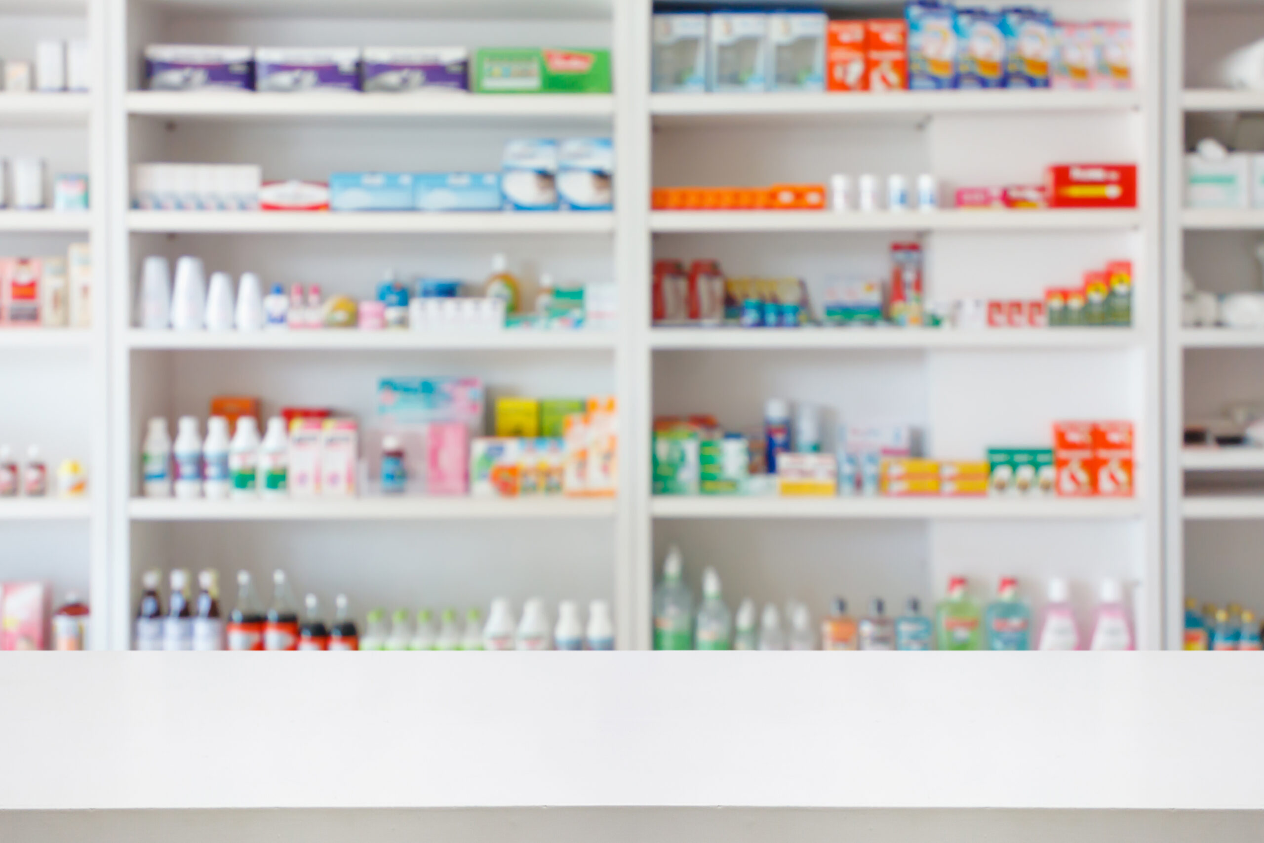 Pharmacy drugstore counter table with blur abstract backbround w