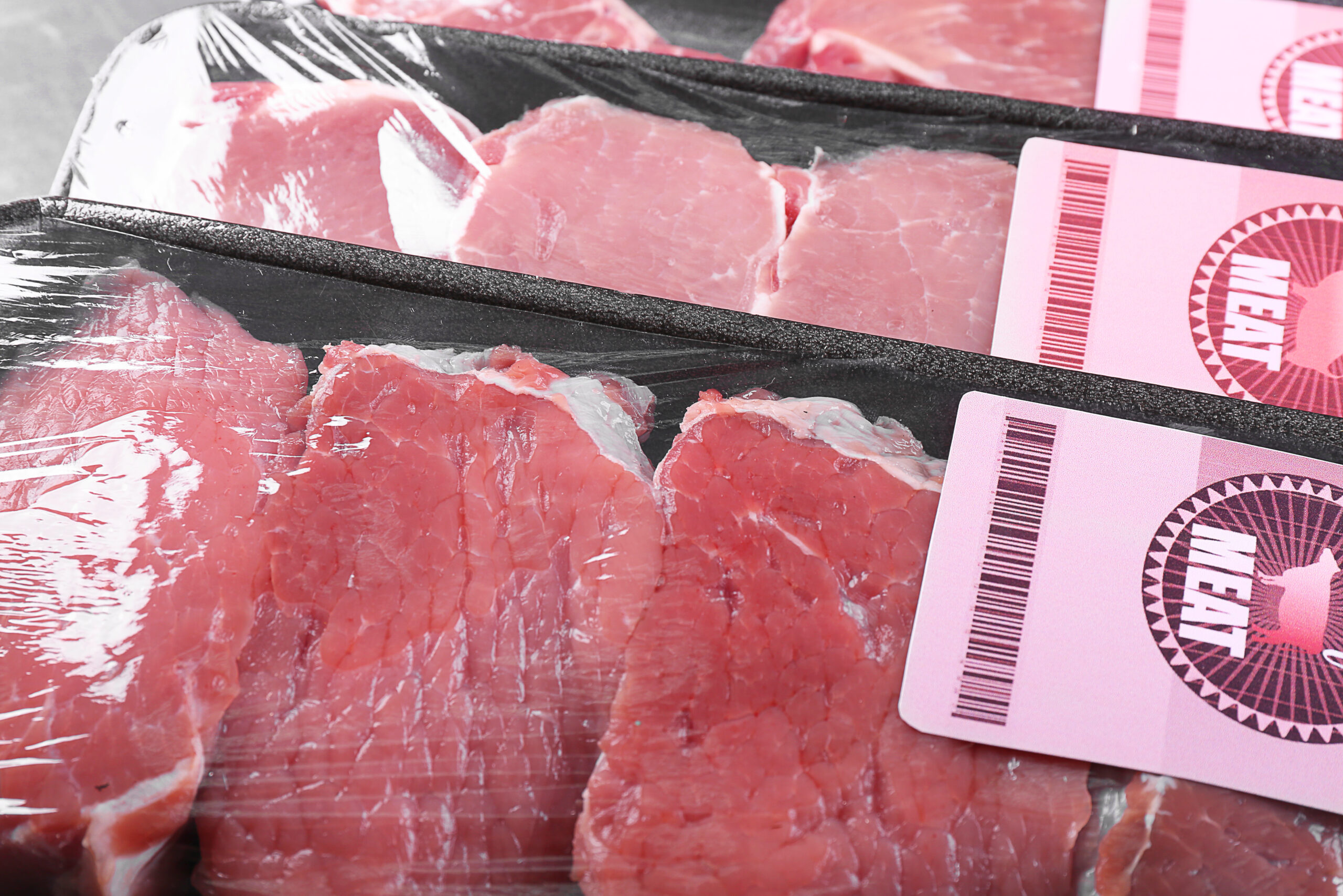 Packed pieces of pork and beef meat, close up